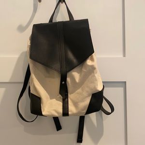Little tan and black backpack